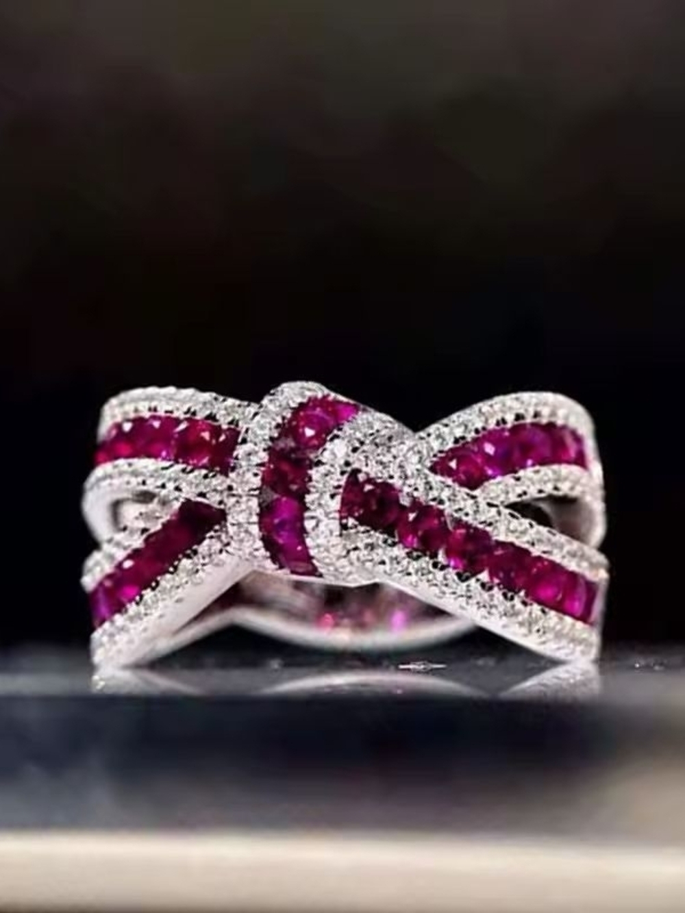 Silver Ring with Pink Ruby Ribbon Design